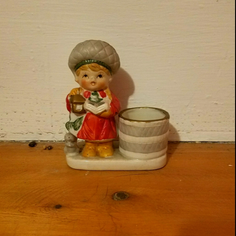 Porcelain doll figure.